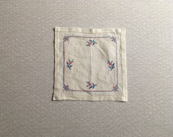 Embroidered linen doily