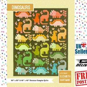 May include: A quilt pattern featuring a variety of colourful dinosaurs on a green background. The pattern includes a stegosaurus, triceratops, and other dinosaurs. The quilt is available in two sizes: 69" x 85" and 48" x 48".