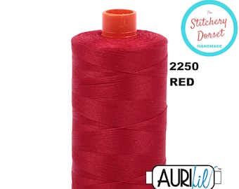 May include: A spool of red Aurifil thread, labeled 2250 Red, with the The Stitchery Dorset Handmade logo.