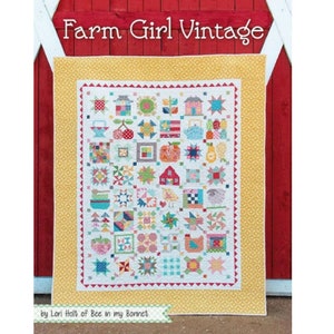 May include: A quilt pattern called "Farm Girl Vintage" by Lori Holt of Bee in my Bonnet. The quilt features a variety of colourful squares with farm-themed designs, including houses, animals, and fruits. The quilt is framed with a yellow border.