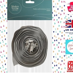 May include: A roll of gray zipper tape with silver metal zipper pulls. The packaging reads "Modern Sewing starts here... Really useful sewing notions by Manter."