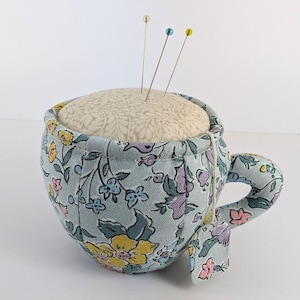 Liberty Teacup Pin Cushion(B). 8cm wide x 6cm high + Handle. Beautiful Teacup pin cushion from Liberty Fabrics, A Liberty Craft Club Product