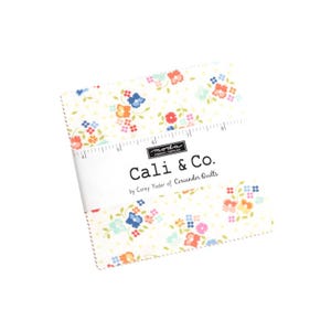 May include: A pack of 5-inch fabric squares featuring a white background with a floral print in shades of blue, pink, orange, and yellow. The fabric squares are labelled "Cali & Co. by Corey Yoder of Coriander Quilts".