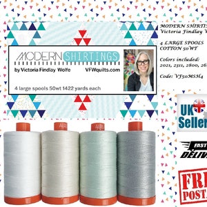 May include: Four large spools of cotton thread in white, cream, mint, and gray. The spools have orange bases and are labeled "AUR". The image includes text that reads "MODERN SHIRTINGS by Victoria Findlay Wolfe".