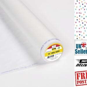 May include: A white roll of fusible interfacing fabric with a label that reads "H 180/308".