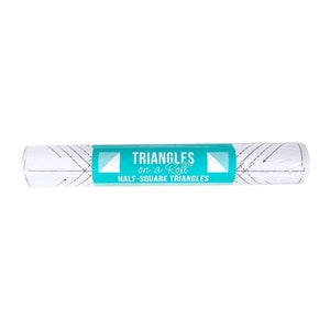 May include: A rolled-up white paper product with a teal label that reads "Triangles on a Roll Half-Square Triangles." The paper has dotted lines and arrows. The product is designed for quilting and sewing.