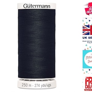 May include: A spool of dark navy blue Gütermann thread. The label reads "Gütermann" at the top and "250 m - 274 yds/vgs" at the bottom. The thread is tightly wound around a white spool.