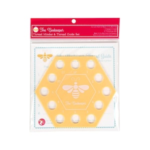 May include: A yellow hexagon-shaped thread guide with 12 holes and a bee design. The guide is labeled "The Beekeeper".