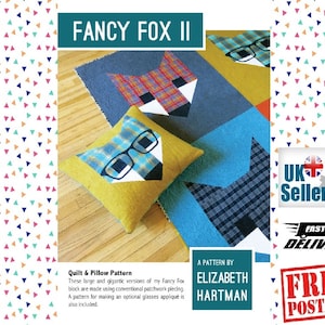 Pode incluir: Um padrão de colcha e almofada com uma raposa de óculos. O padrão chama-se "Fancy Fox II" e é de Elizabeth Hartman. O padrão inclui instruções para fazer uma aplicação de óculos opcional.