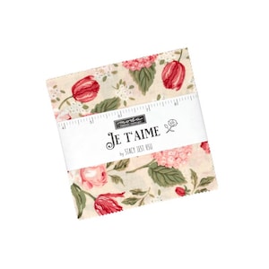 May include: A stack of square fabric pieces featuring a floral pattern with red tulips, pink hydrangeas, and green leaves on a cream background. A white paper band wraps around the center, printed with the text Je T'aime by Stacy Iest Hsu.