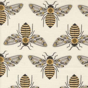 May include: Cream-colored fabric with a repeating pattern of stylized bees. Each bee has a black and yellow striped abdomen, gray and yellow patterned wings, and a detailed head. The design is symmetrical and creates a visually appealing, nature-inspired textile.