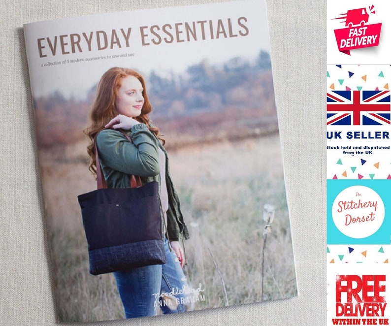 May include: A book titled "Everyday Essentials" with a collection of 5 modern accessories to sew and love. The book cover features a woman wearing a green jacket and blue jeans, holding a black and blue tote bag with brown straps. The book cover also features the text "noodlehead ANNA GRAHAM".