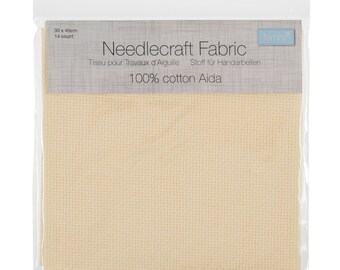 May include: A package of 14 count white Aida fabric for needlepoint, cross stitch, or other needlework projects. The package is labeled "Needlecraft Fabric" and "100% cotton Aida".