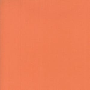 May include: Solid orange fabric with a subtle woven texture. The fabric has a warm, inviting color, suitable for various crafting and sewing projects. The material appears to be a medium weight, ideal for apparel or home decor.