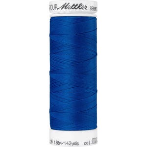 May include: A spool of blue thread with the text "SERAFIL GROUP Mattler" on the label. The spool is 138m/142 yds and colour 002.