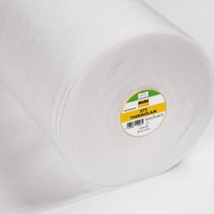 May include: A white roll of 372 Therm-O-Lam interfacing fabric. The label is yellow with black text and a green border.