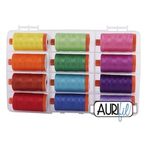 May include: A clear plastic organizer filled with colorful spools of thread. The thread colors include yellow, green, pink, orange, dark green, purple, red, blue, and purple. The spools have orange ends. The brand name "AURIfil" is visible.