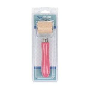 May include: A pink handled quick press tool with a wooden roller, packaged in a clear plastic container. The packaging has the text "TEA ROSE Quick Press" in a blue and white design.