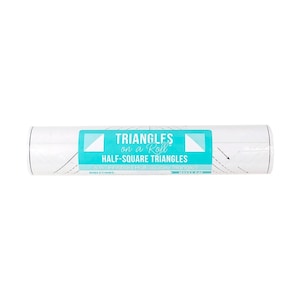 May include: A roll of white fabric with a turquoise label that reads "Triangles on a Roll Half-Square Triangles 3 1/2" Finished Half-Square Triangles Makes 640"