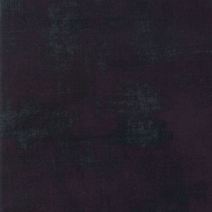 May include: A dark, textured background with a blend of deep purple and black hues. The surface has a distressed appearance, with subtle variations in color and texture, creating a vintage or aged aesthetic.