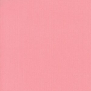 May include: A solid pink fabric swatch. The fabric has a smooth, even texture.