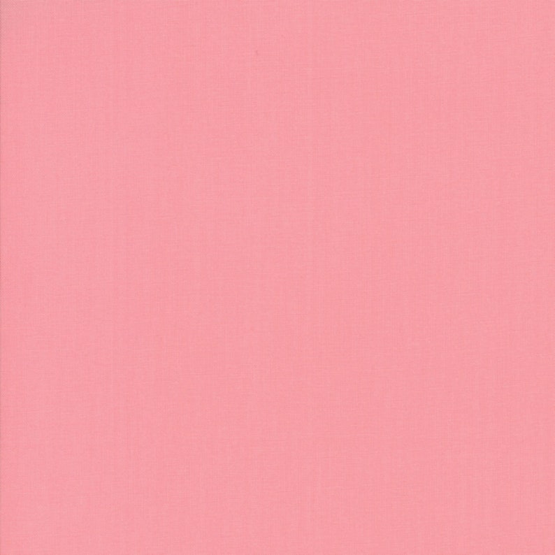May include: A solid pink fabric swatch. The fabric has a smooth, even texture.