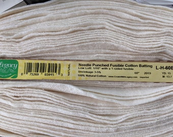 May include: A roll of natural colored needle-punched fusible cotton batting. The label reads "Low Loft: 1/16" with a 1-sided fusible Shrinkage 3-5% 60" 2019 100% Natural Cotton www.CreateWithLegacy.com imported YD: 15 M: 13.7"