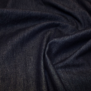 8oz Washed Denim Fabric 'Shade Dark Denim Blue'.  58in (145cm) Wide. 100% Cotton. Weight 287 gsm. For clothing, craft and furnishings.