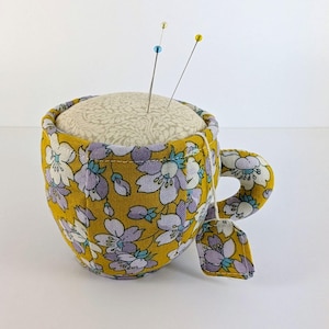Liberty Teacup Pin Cushion(A). 8cm wide x 6cm high + Handle. Beautiful Teacup pin cushion from Liberty Fabrics, A Liberty Craft Club Product