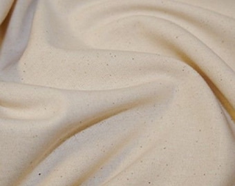 May include: A close-up of a natural, off-white fabric with a slightly textured surface. The fabric is folded and draped, showcasing its soft and drapey quality.
