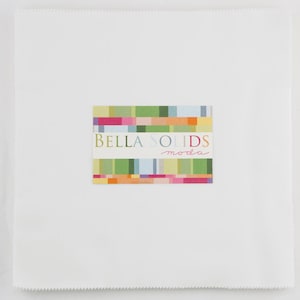 May include: A white fabric square with a colorful label that reads "Bella Solids moda".