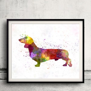 May include: A watercolor painting of a dachshund dog in shades of yellow, green, red, and purple. The dog is standing on a white background with splatters of paint.