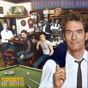 May include: A vintage album cover for Huey Lewis and the News's "Sports" album. The cover features a group of men in a bar setting, with a pool table in the foreground. The album title "Sports" is printed in yellow letters on the pool table.