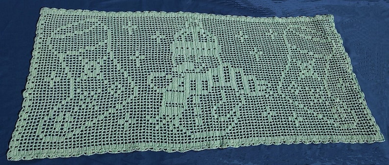 May include: A rectangular, light green crocheted doily with a detailed openwork design. The doily features a central motif and a scalloped edge. The open weave allows the background color to show through, creating a delicate and airy appearance.