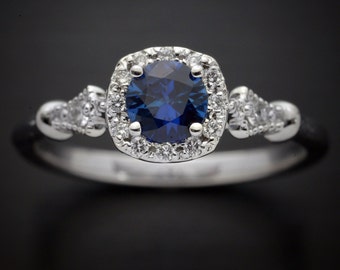 Halo engagement ring with a natural deep blue  sapphire cushion halo style with natural diamonds accents yellow, white pink gold or platinum