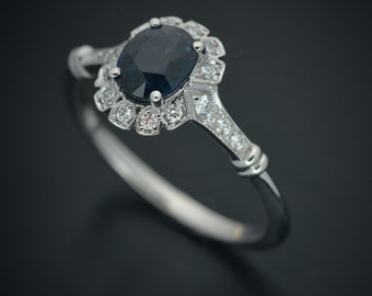 oval blue Sapphire engagement ring with a halo in white gold .80ct natural sapphire from Australia