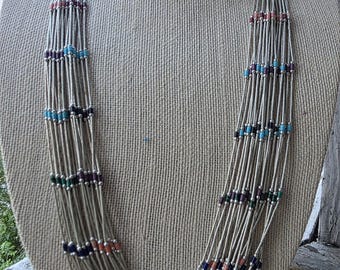 Vintage Native American 20-strand liquid silver necklace with stone accent beads.