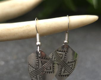 Native American handmade earrings with sterling stampwork.