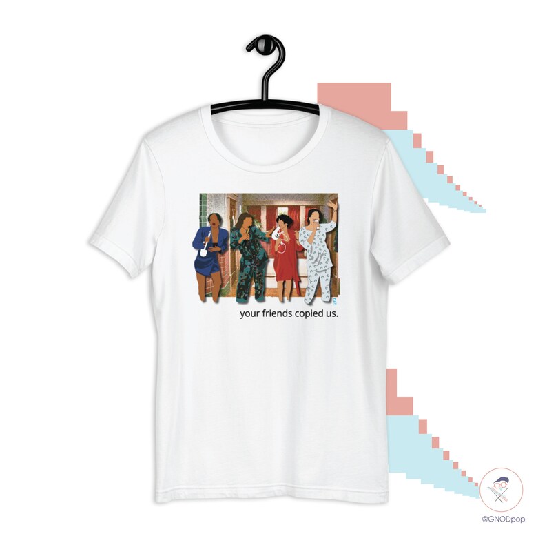 May include: White t-shirt with a graphic of four people in pajamas standing in a hallway. The text "your friends copied us." is printed below the graphic.