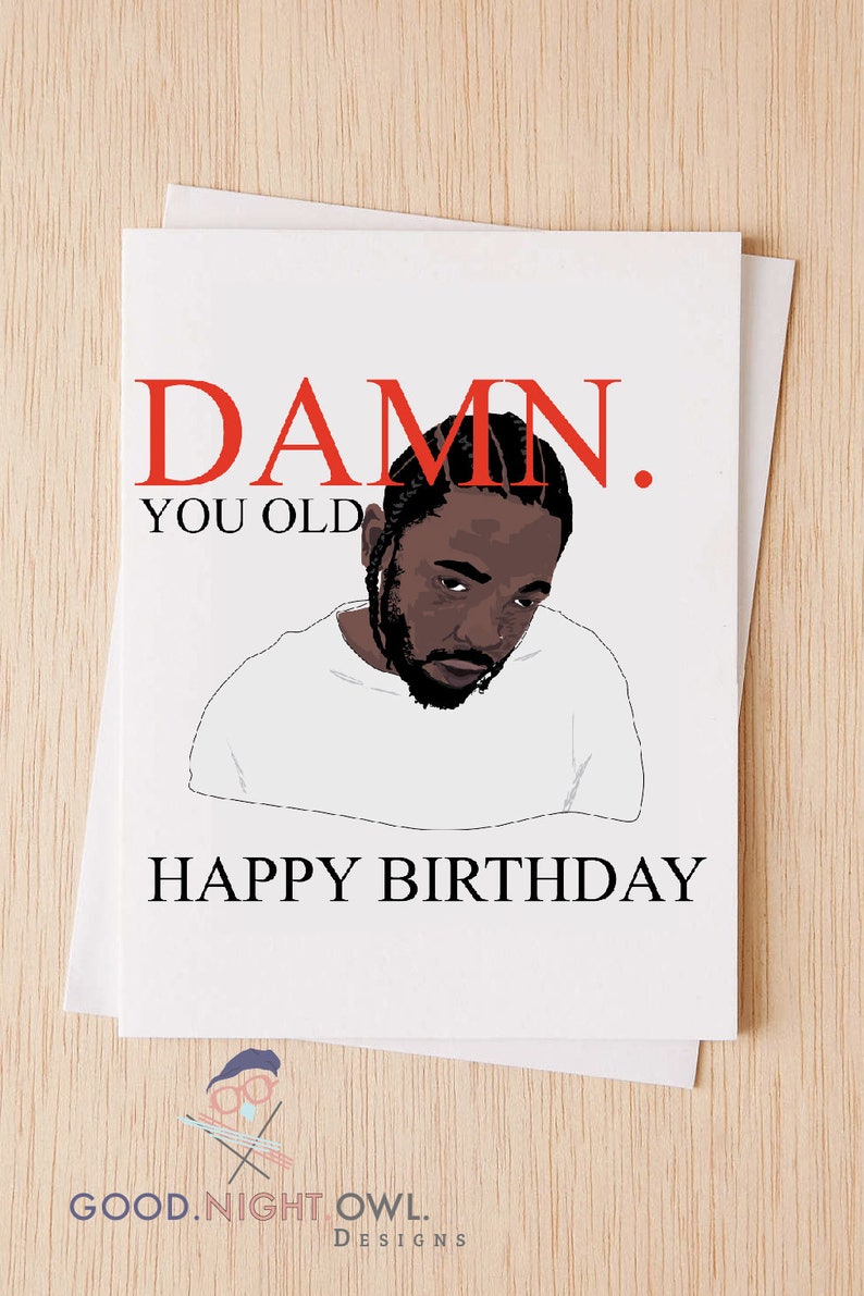 May include: A white card with red text that says "DAMN. YOU OLD" and a black and white illustration of a man with a beard. The text "HAPPY BIRTHDAY" is below the illustration.