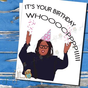 May include: A birthday card featuring a cartoon illustration of a woman wearing a pink and blue party hat and raising her arms in the air. The text on the card reads "It's your birthday WHOOOOOPPPPPIIIII!"