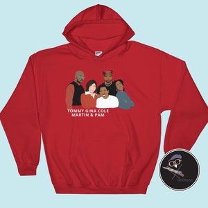 May include: Red hooded sweatshirt with a white graphic of the cast of the TV show Martin. The graphic includes the characters Tommy Strawn, Gina Waters-Strawn, Martin Payne, and Pam James. The text below the graphic reads "Tommy Gina Cole Martin & Pam".