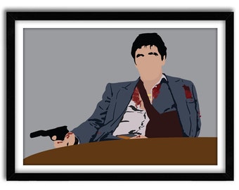 May include: A man in a blue suit with a white shirt and a red tie sits at a table with a gun in his hand. He has a bandage on his arm and blood stains on his shirt. The background is a grey wall.