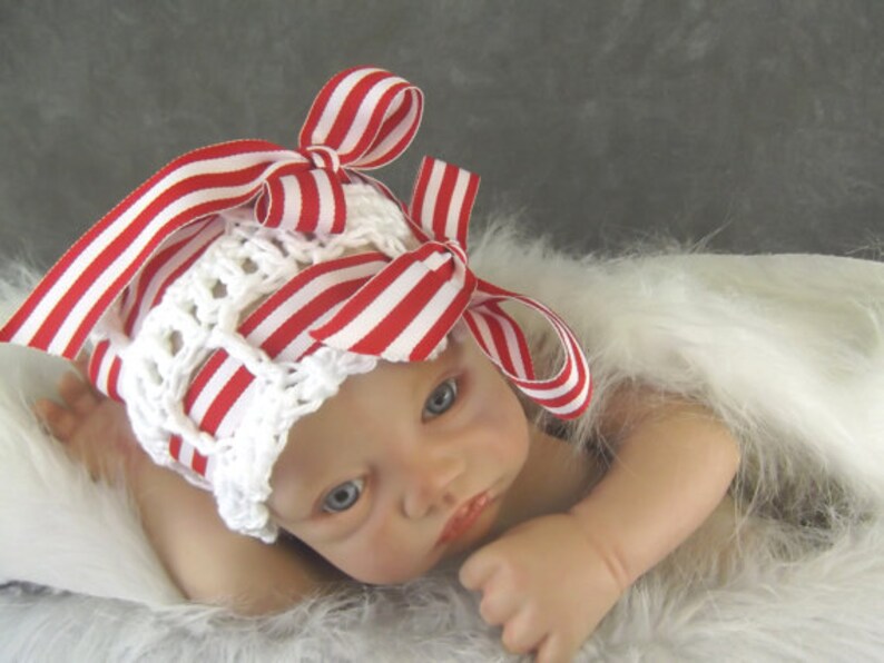 white cotton newborn hat