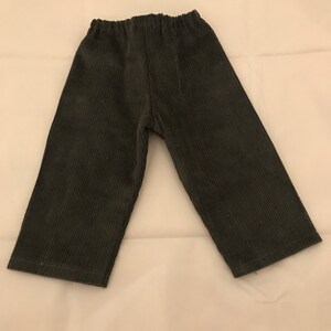 May include: A pair of dark grey corduroy trousers with an elastic waistband.