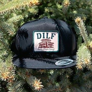 May include: Black trucker hat with a white patch that says "DILF dang, I love fungi!" and a mushroom graphic.