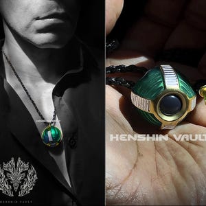 May include: A green and gold pendant necklace with a round, textured orb pendant. The orb has a black centre and white accents. The necklace is on a black cord and is worn by a person.