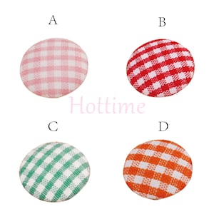 May include: Four round fabric buttons with a gingham pattern. The buttons are in pink, red, green, and orange. The word "Hottime" is printed in pink across the center of the image.