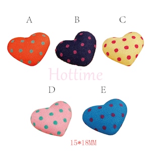 May include: Five heart-shaped fabric embellishments with polka dots in various colours: orange, navy, yellow, pink, and blue. Each heart measures 1.5cm x 1.8cm. The word "Hottime" is printed in pink. The text "15*18MM" is printed in black.
