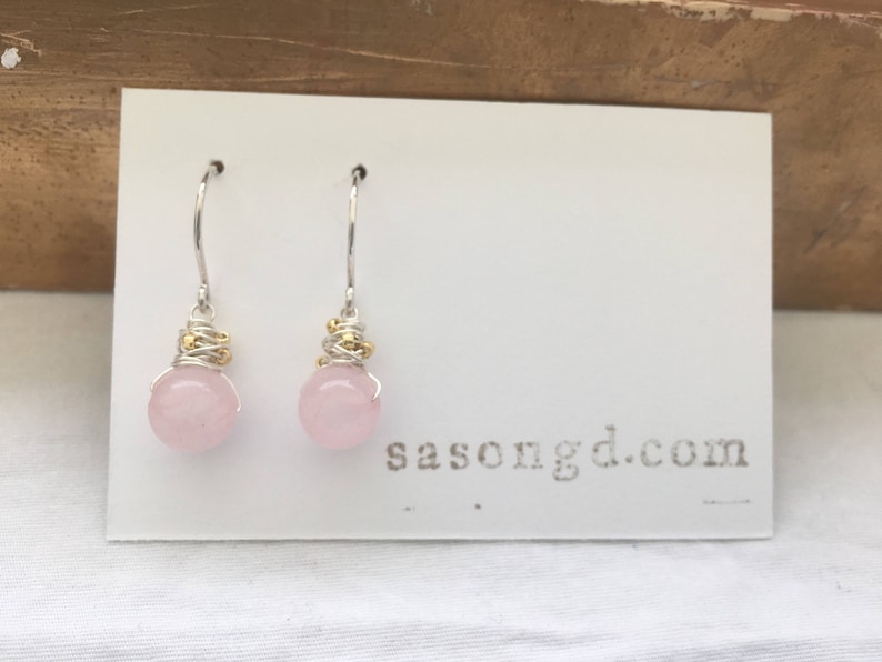 Rose quartz with gold accents wrapped in sterling silver filled wire